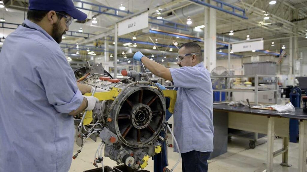 men working on engine