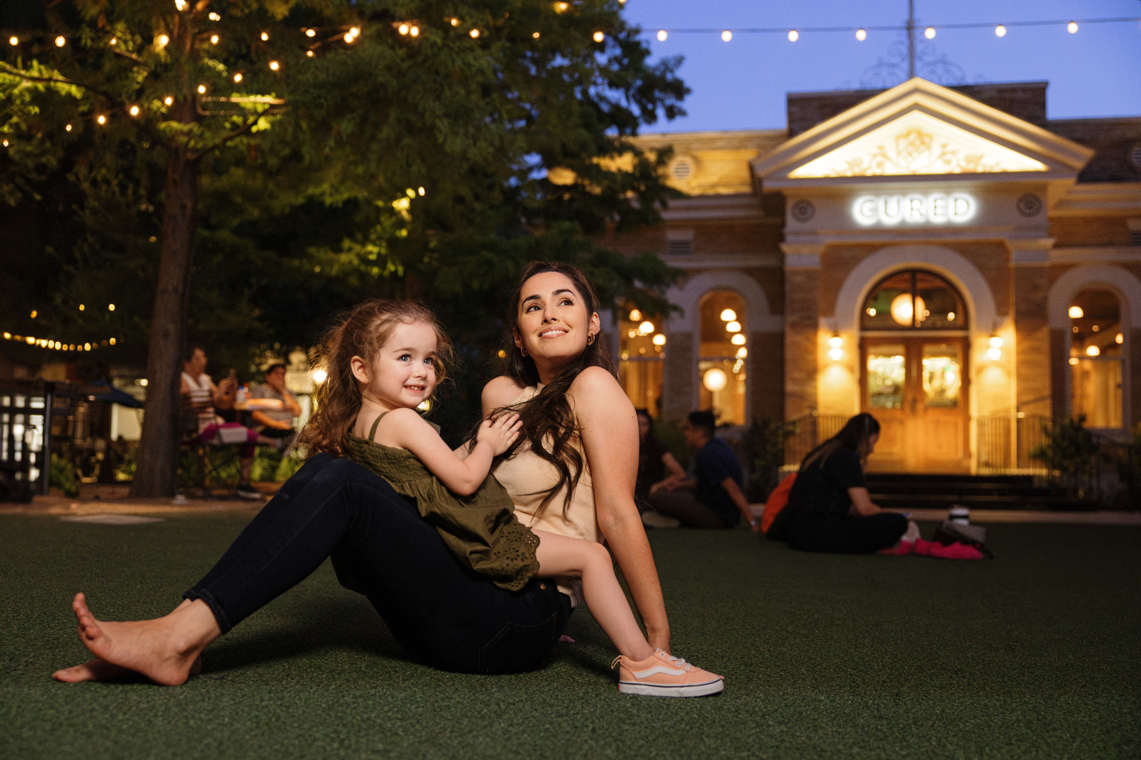 mother and daughter on grass