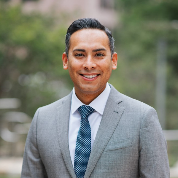 Professional headshot of Adrian Castillo